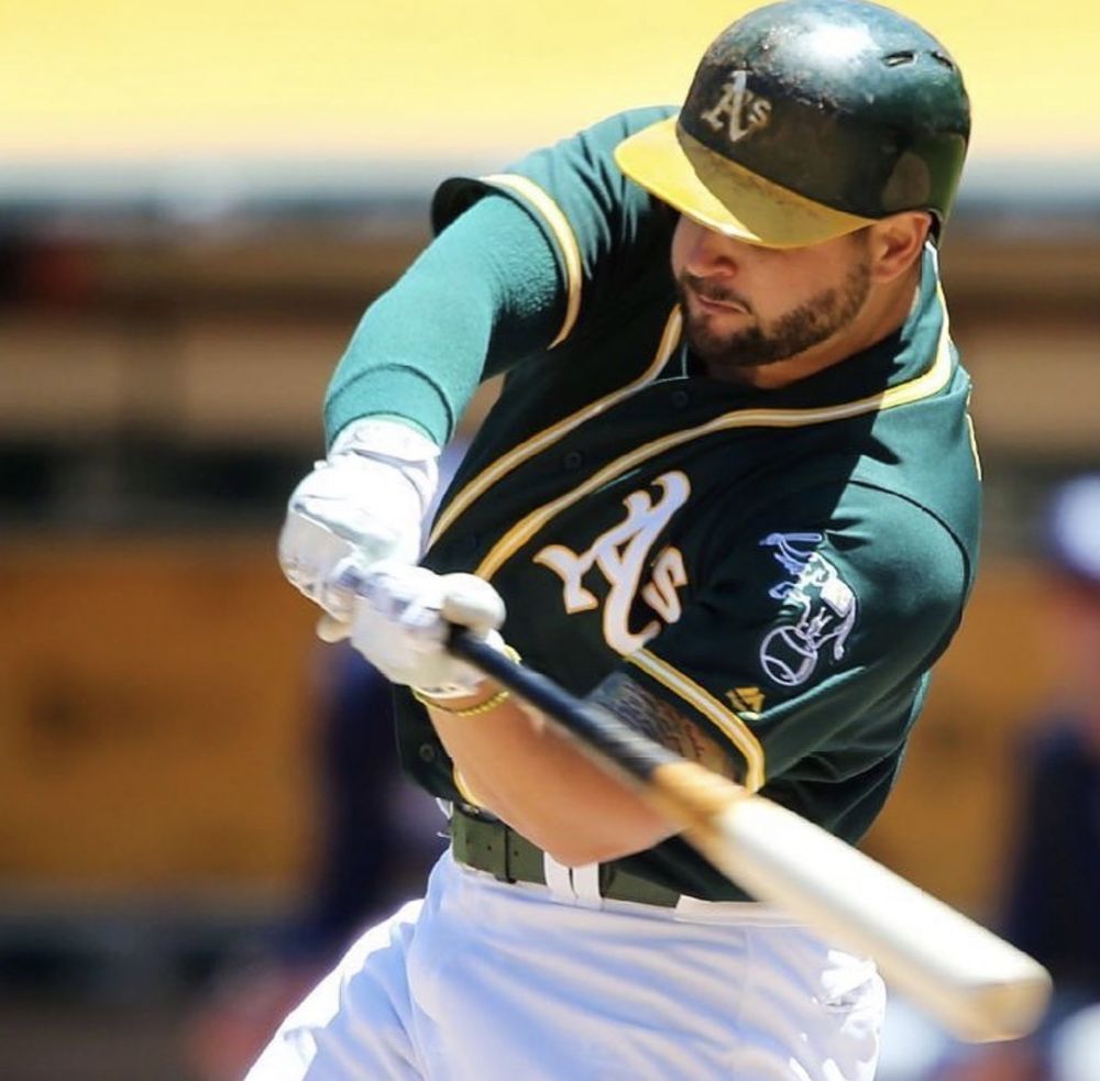 Yonder Alonso batting in an Athletics game