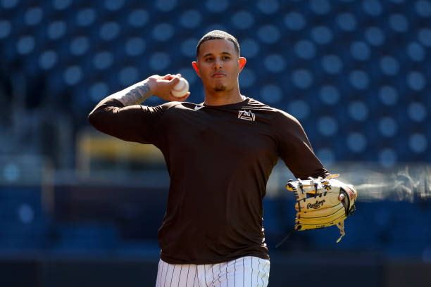 Manny Machado throwing during training