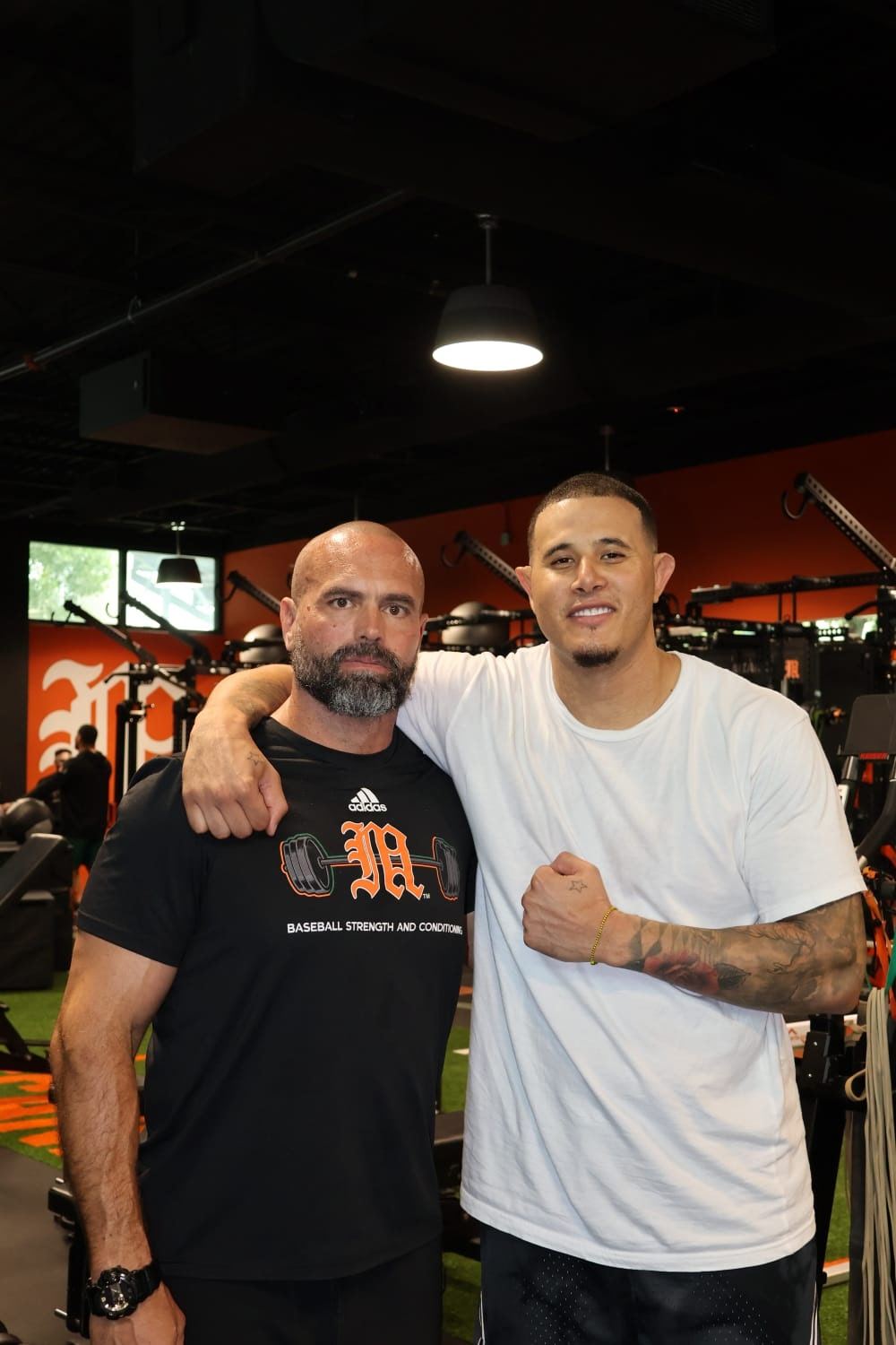 Manny Machado and his coach at the Miami facility