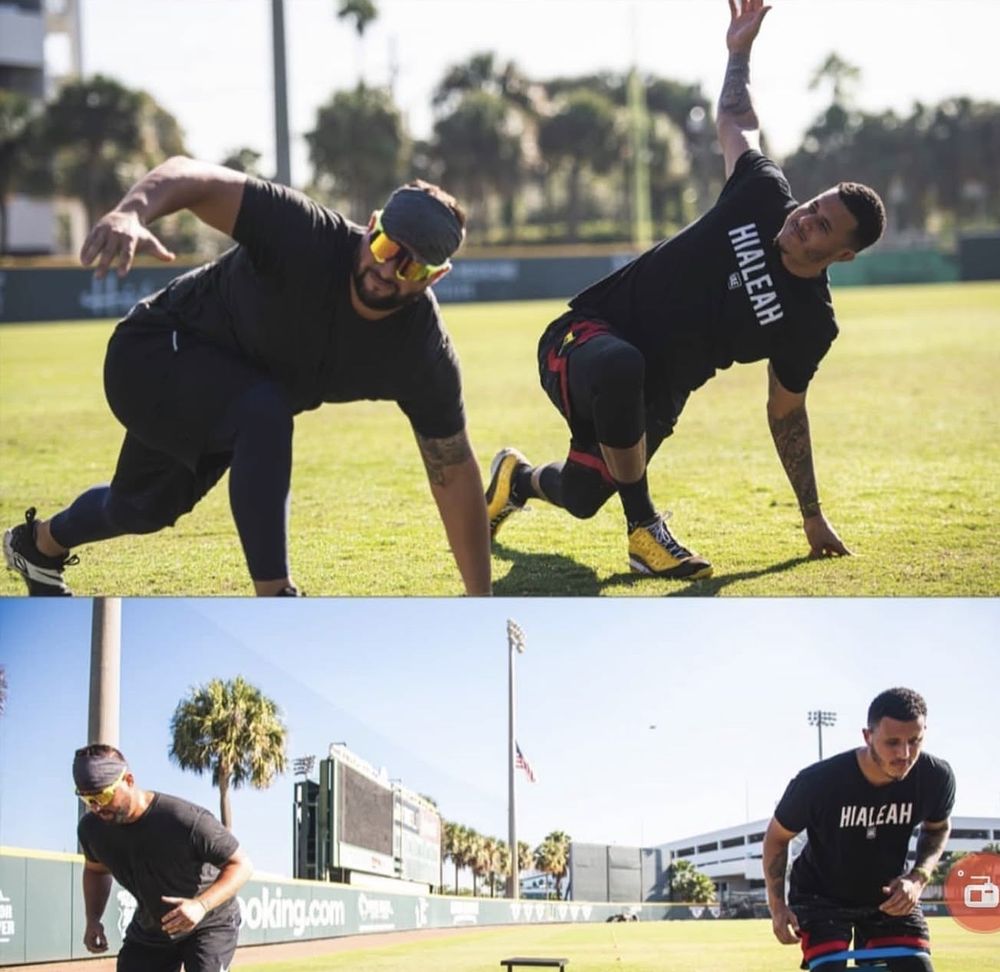 Manny Machado and Yonder Alonso stretching before training